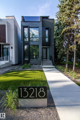 Modern facade featuring a dark brick and stucco exterior - 13218 102 Avenue, Edmonton, AB 