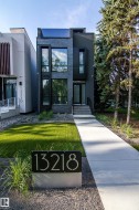 Modern facade featuring a dark brick and stucco exterior - 