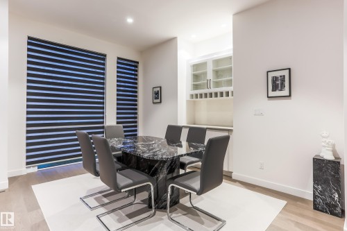 Open-concept room featuring wood-finish flooring and recessed lighting - 13218 102 Avenue, Edmonton, AB 