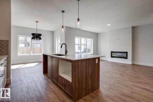 13 Scoria Wynd, Fort Saskatchewan, AB - Indoor Photo Showing Kitchen With Fireplace