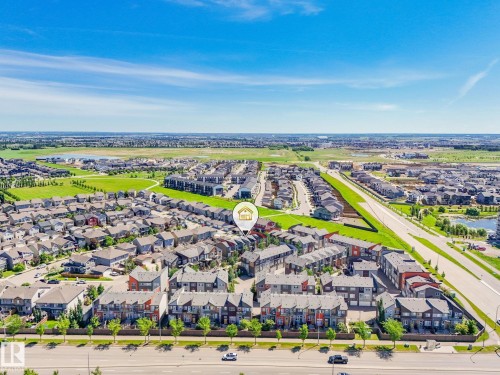 Aerial perspective showcasing a residential community with varied architectural styles - 55 4470 Prowse Road, Edmonton, AB 