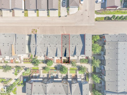 Aerial perspective showcasing a townhome property with a grey shingle roof - 55 4470 Prowse Road, Edmonton, AB 