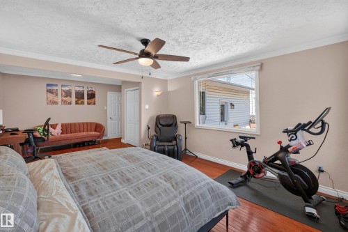Hardwood-finish flooring extending throughout the room - 11015 122 Street, Edmonton, AB 