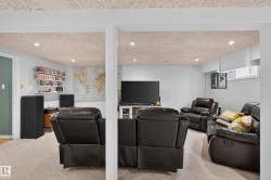 Recreation room featuring recessed lighting, a drop ceiling, and light-colored carpeting - 