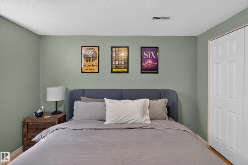 Neutral-toned wall paint complements the light wood-finish flooring - 11015 122 Street, Edmonton, AB 