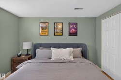 Neutral-toned wall paint complements the light wood-finish flooring - 