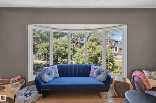 Expansive bay window featuring white trim and multiple panes of glass - 11015 122 Street, Edmonton, AB 