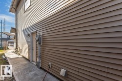 Light brown horizontal siding encompassing the exterior - 