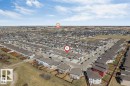 Aerial perspective showcasing a developed residential neighborhood with a variety of single-family homes - 1715 27 Street, Edmonton, AB 
