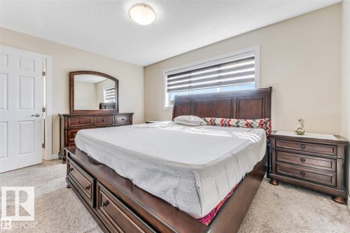 Neutral tone wall paint, textured ceiling, and soft carpet flooring - 1715 27 Street, Edmonton, AB 