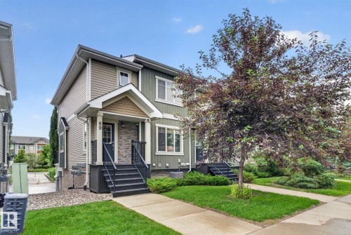 Two-story residence featuring a covered front entry with stone veneer accents - 89 9535 217 Street, Edmonton, AB 