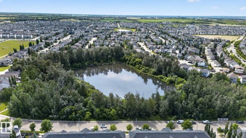 Residential neighborhood surrounding a tranquil pond and mature trees - 89 9535 217 Street, Edmonton, AB 