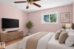 Room with wood-finish flooring, a white-framed window, and a ceiling fan with light fixture - 