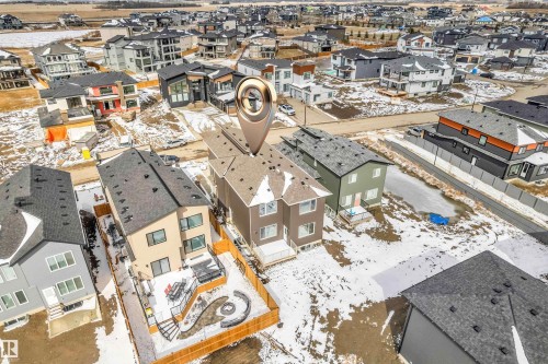 Contemporary two-story residence with a multi-level deck and a spiral staircase - 2611 62 Avenue, Rural Leduc County, AB - Outdoor With View