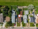 Single-family residence with a brown shingle roof and a concrete driveway - 14530 37 Street, Edmonton, AB 