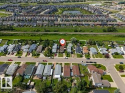 Residential neighborhood featuring a variety of single-family homes, mature trees, and paved streets - 