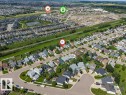 Aerial perspective showcasing a residential area with various housing styles and green spaces - 14530 37 Street, Edmonton, AB 