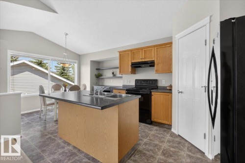 7928 10 Avenue, Edmonton, AB - Indoor Photo Showing Kitchen With Double Sink