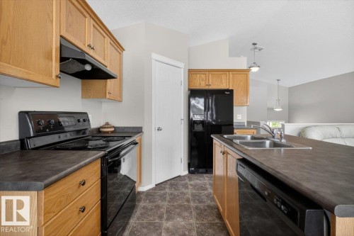 7928 10 Avenue, Edmonton, AB - Indoor Photo Showing Kitchen With Double Sink