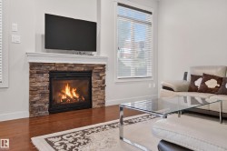 Stone-clad fireplace with mantel and hearth - 