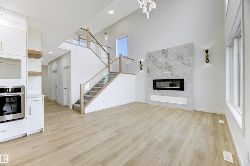 6 Sorel Avenue, Beaumont, AB - Indoor Photo Showing Living Room With Fireplace