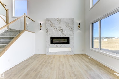 6 Sorel Avenue, Beaumont, AB - Indoor Photo Showing Other Room With Fireplace