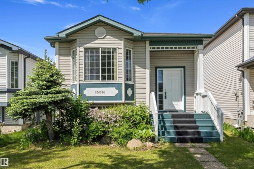 Welcoming entry with white paneled door and sidelights - 15016 134 Street, Edmonton, AB 
