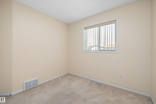 Neutral-toned wall paint and carpeting throughout - 15016 134 Street, Edmonton, AB 