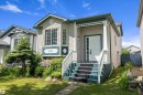 Light beige siding exterior with dark green trim accents - 15016 134 Street, Edmonton, AB 