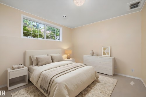 Recessed window featuring a verdant outdoor scene, neutral wall tones, and overhead lighting - 15016 134 Street, Edmonton, AB 
