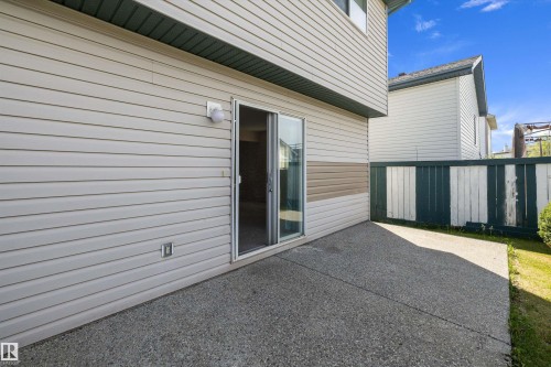 Ground-level patio with sliding glass door access - 15016 134 Street, Edmonton, AB 