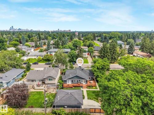 Aerial perspective showcasing a residential neighborhood with a distant cityscape - 8212 148 Street Nw, Edmonton, AB 