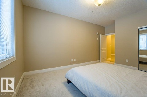 149 6079 Maynard Way Nw, Edmonton, AB - Indoor Photo Showing Bedroom