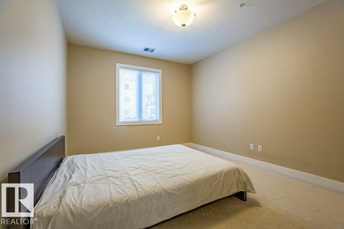 149 6079 Maynard Way Nw, Edmonton, AB - Indoor Photo Showing Bedroom