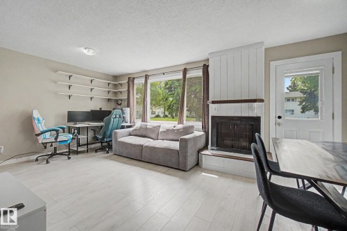 4315 46 Street, Stony Plain, AB - Indoor Photo Showing Living Room With Fireplace