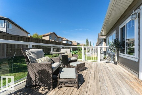 Expansive outdoor wood deck with a clear panel railing system - 15 175 Mcconachie Drive, Edmonton, AB 
