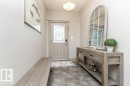 Entryway featuring a decorative front door with leaded glass, tile flooring, and a flush mount ceiling light - 15 175 Mcconachie Drive, Edmonton, AB 