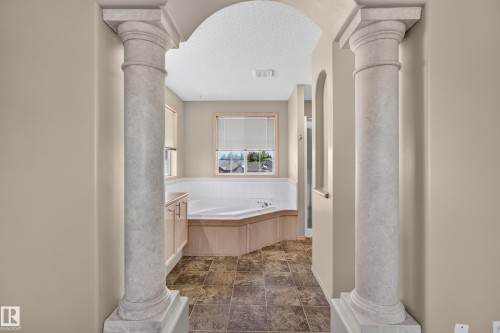 Archway entry featuring classic columns - 13406 32A Street, Edmonton, AB 