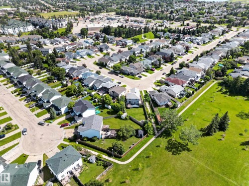 Residential neighborhood with a variety of single-family homes featuring green lawns and mature trees - 13406 32A Street, Edmonton, AB 