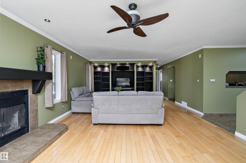 5609 58 Street, Beaumont, AB - Indoor Photo Showing Living Room With Fireplace