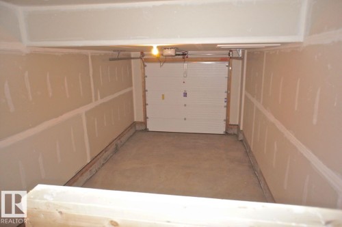 180 Radcliffe Wynd, Fort Saskatchewan, AB - Indoor Photo Showing Garage