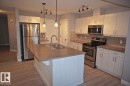180 Radcliffe Wynd, Fort Saskatchewan, AB  - Indoor Photo Showing Kitchen With Stainless Steel Kitchen With Double Sink 