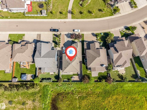 Aerial view showcasing a residential property with a multi-gabled roofline and an attached garage - 656 180 Street Sw, Edmonton, AB - Outdoor With View