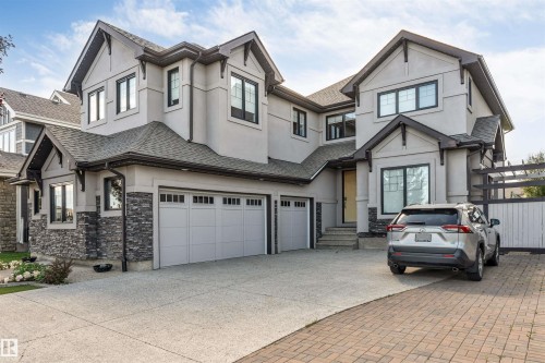 Contemporary residence with a multi-textured facade including stucco and stone accents - 656 180 Street Sw, Edmonton, AB - Outdoor With Facade