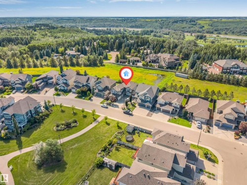 Aerial perspective showcasing a residential neighborhood with landscaped green spaces - 656 180 Street Sw, Edmonton, AB - Outdoor With View