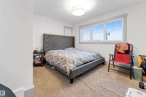 Bright room featuring neutral carpet flooring and white walls - 656 180 Street Sw, Edmonton, AB - Indoor Photo Showing Bedroom