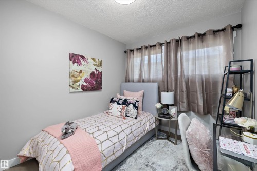Light gray walls complement the textured ceiling - 12912 103 Street, Edmonton, AB 