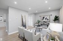 Recessed ceiling lighting illuminates light gray walls and wood-finish flooring - 12912 103 Street, Edmonton, AB 