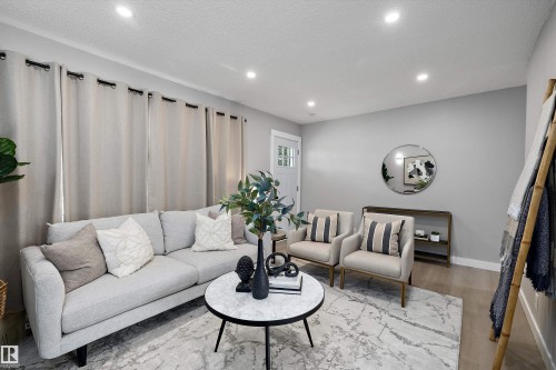 Living area featuring light gray wall paint and recessed ceiling lighting - 12912 103 Street, Edmonton, AB 