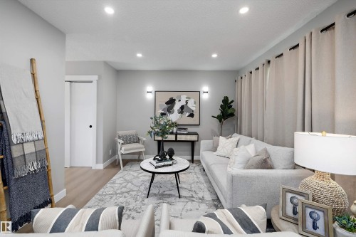 Living area featuring light wood-finish flooring and recessed ceiling lighting - 12912 103 Street, Edmonton, AB 